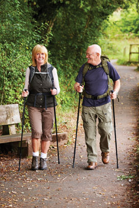An elderly couple enjoying a hike