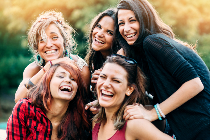 Teenage girls smiling in the park