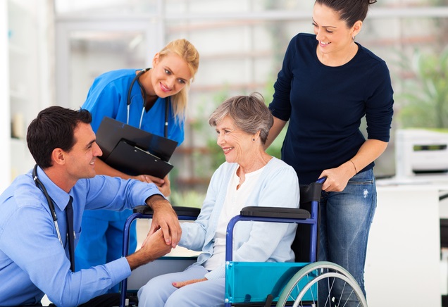 male doctor comforting senior patient