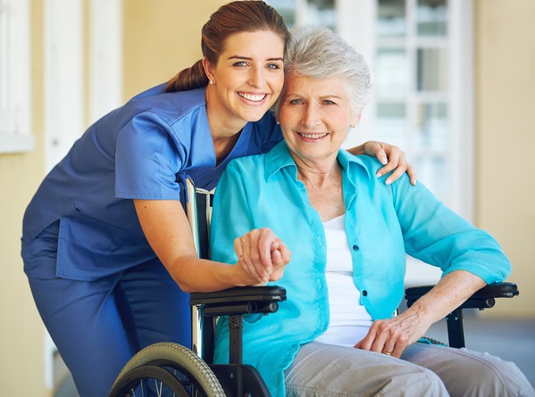 Portrait of a doctor caring for her senior patient at a nursing