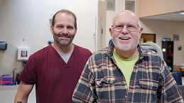 Healthcare worker helping a patient