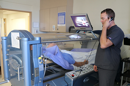 Healthcare worker working with patient in Hyperbaric Oxygen Therapy Chamber