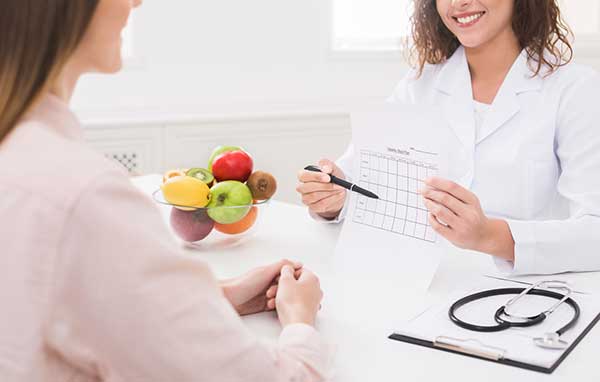 Doctor showing patient a chart