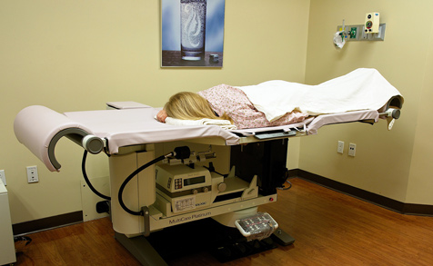 Woman Lying Face Down in Medical Bed